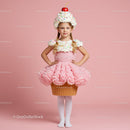 Little girl dressed as a whimsical cupcake costume
