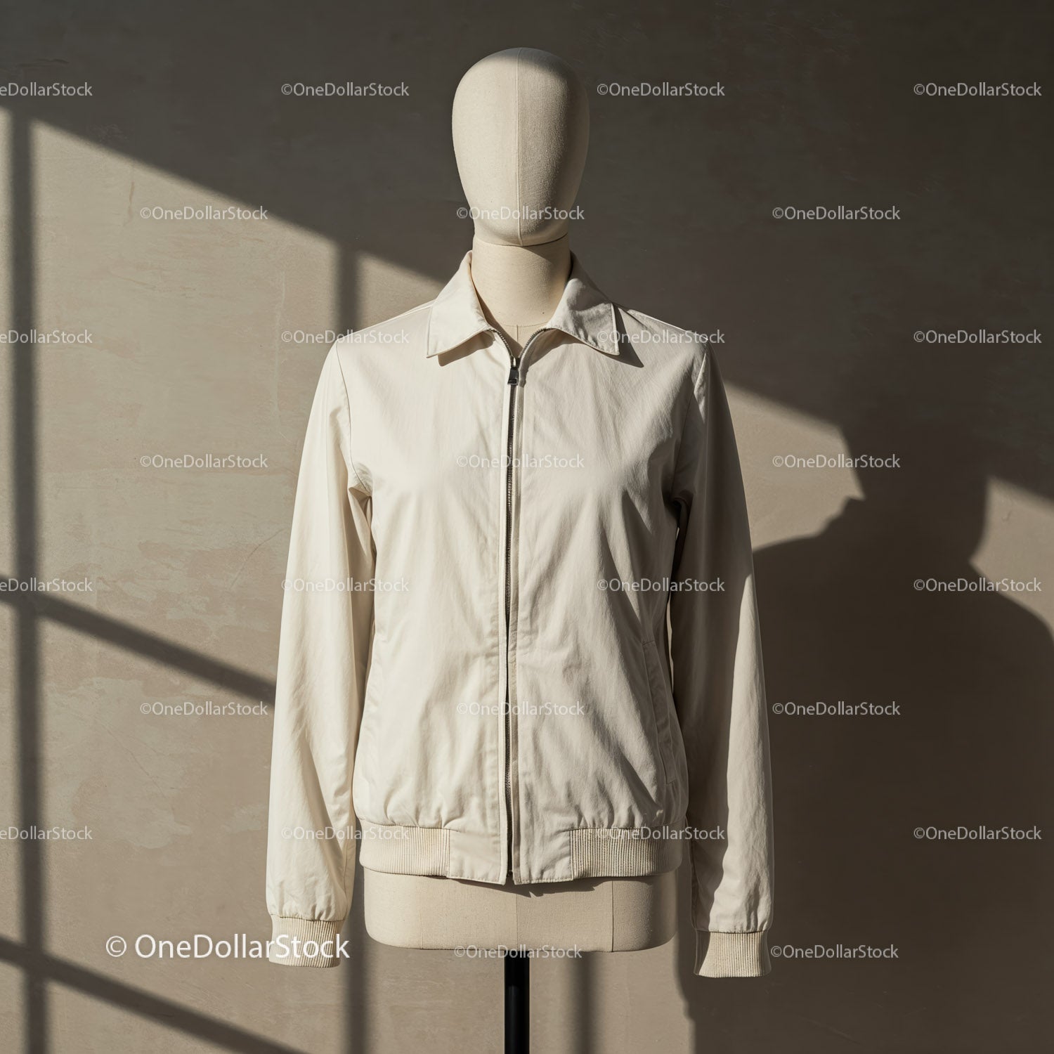 Minimalist beige jacket on mannequin with natural light