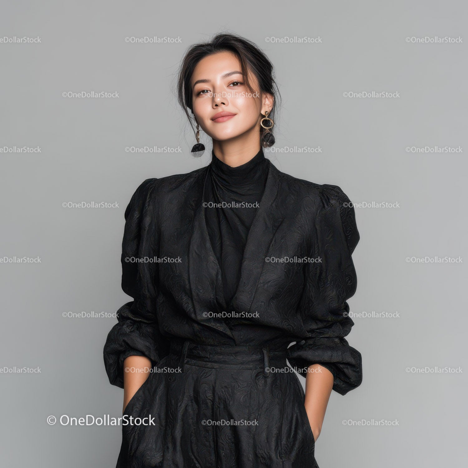 Stylish Woman in Black Outfit with Statement Earrings in Fashion Portrait
