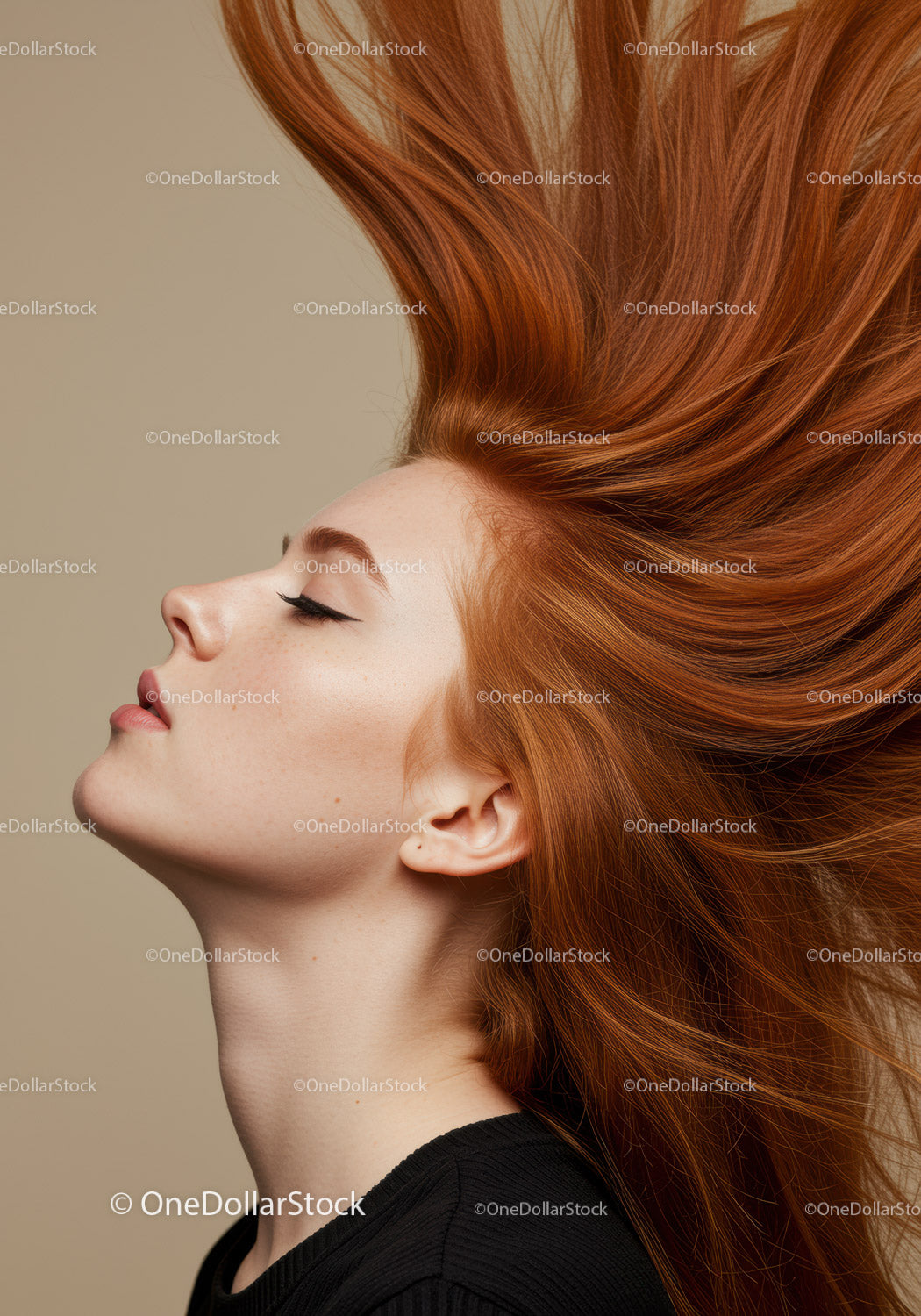Profile of woman with flowing red hair and closed eyes