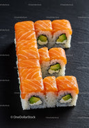 Fresh salmon sushi rolls arranged in letter shape