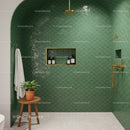 Modern shower with green scallop tiles and gold fixtures