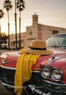 Vintage Red Car with Yellow Cloth and Straw Hat in Sunset Scene