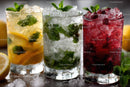 Colorful Fruit Infused Cold Drinks with Ice and Mint