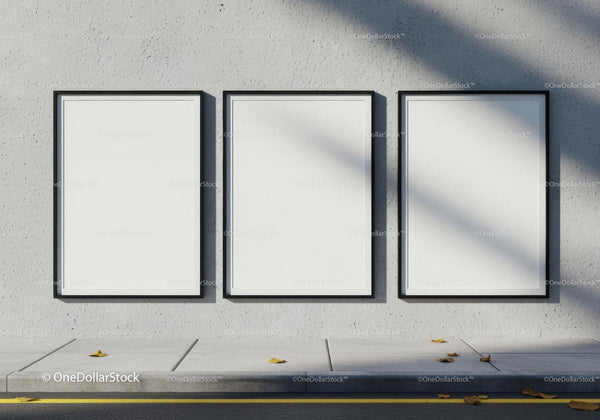 Three Blank Black Frames on Concrete Wall with Sidewalk JPG Mockup Image