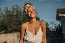 Joyful Woman Smiling Outdoors in Summer Casual Outfit