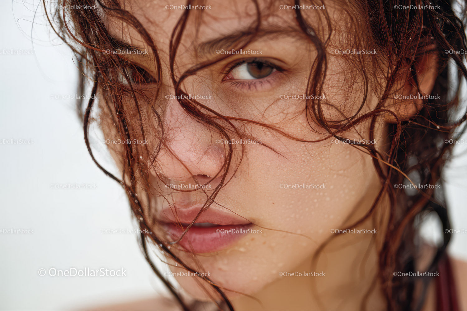 Close-up of Young Woman with Wet Hair and Water Droplets