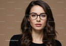 Elegant Woman Wearing Glasses in Portrait Shot with Brown Hair
