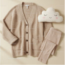 Cozy beige cardigan with leggings and cute cloud pillow