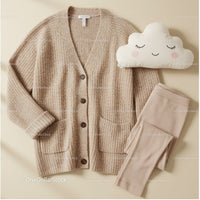 Cozy beige cardigan with leggings and cute cloud pillow