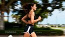 Athletic woman running outdoors in black fitness wear
