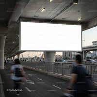 Blank urban billboard above busy city sidewalk at dusk