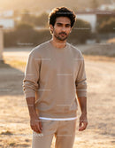 Casual young man standing outdoors in soft sunlight