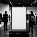 Blank Poster Stand in Modern Fashion Store Interior