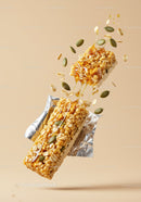 Crunchy granola bar with honey and seeds splash