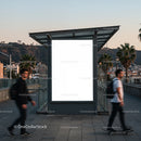 Urban street scene with blank billboard at dusk