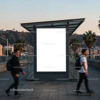 Urban street scene with blank billboard at dusk