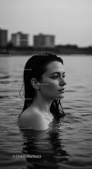 Serene Woman in Water with City Skyline in Black and White