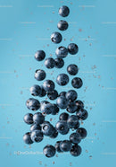 Fresh blueberries suspended in clear water with bubbles