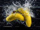 Vibrant Yellow Bananas Splashing into Water in Dynamic Scene
