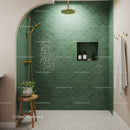Modern bathroom shower with green scallop tiles and gold fixtures