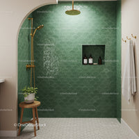 Modern bathroom shower with green scallop tiles and gold fixtures