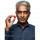 Senior Man Holding Raspberry Portrait with Positive Wellness Expression