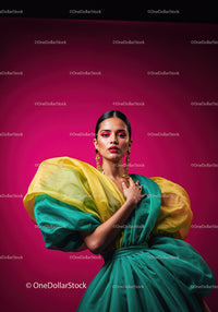Fashion Model in Vibrant Pink and Yellow Flowing Gown