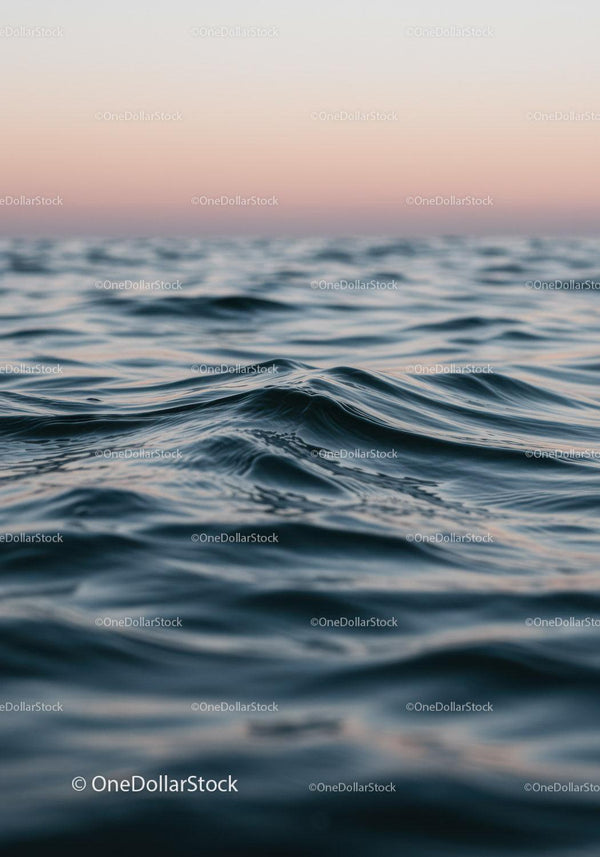 Calm Ocean Waves with Soft Pastel Sky in Tranquil Seascape
