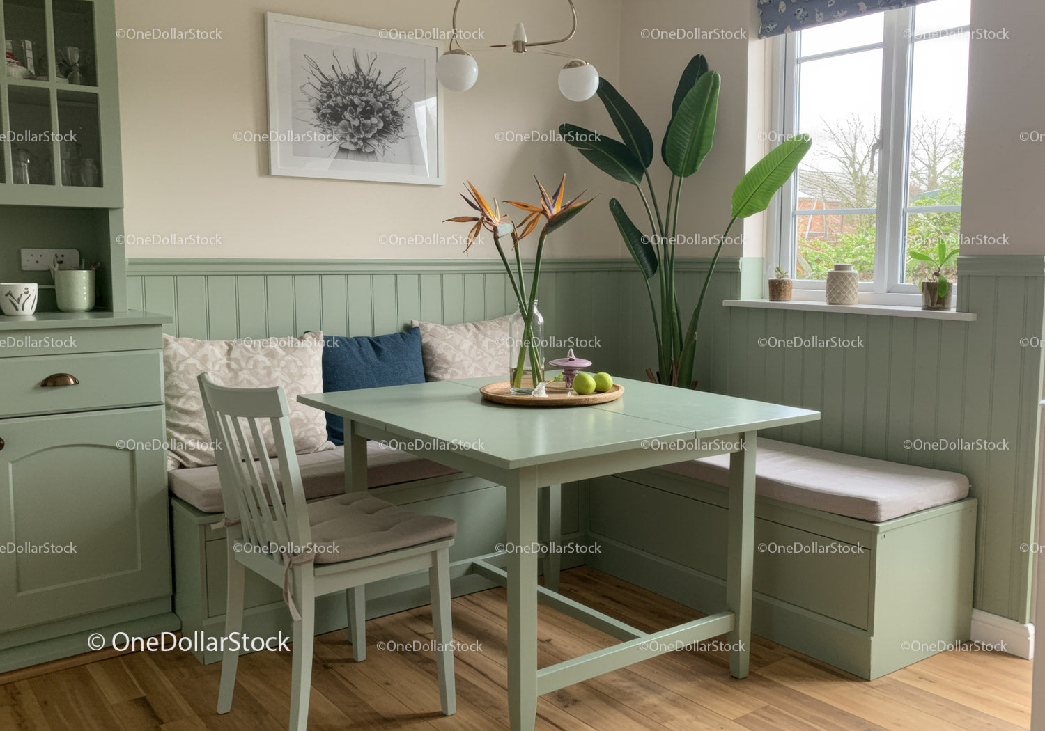 Bright and Airy Kitchen Nook with Green Plants and Cozy Seating
