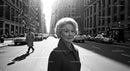 Elegant Older Woman Standing on City Street in Black and White