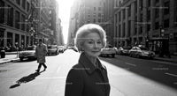 Elegant Older Woman Standing on City Street in Black and White