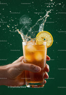 Refreshing iced tea with lemon slice splash