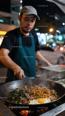 Street Food Chef Cooking Frying Noodles with Egg at Night Market