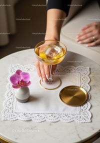 Elegant Cocktail with Lemon and Ice on Marble Table with Orchid