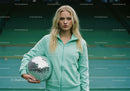 Young Woman Holding Disco Ball in Casual Sportswear on Tennis Court