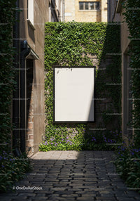 Blank billboard on ivy covered wall in narrow alley
