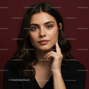 Close-up Portrait of a Beautiful Woman with Brown Hair on Red Background