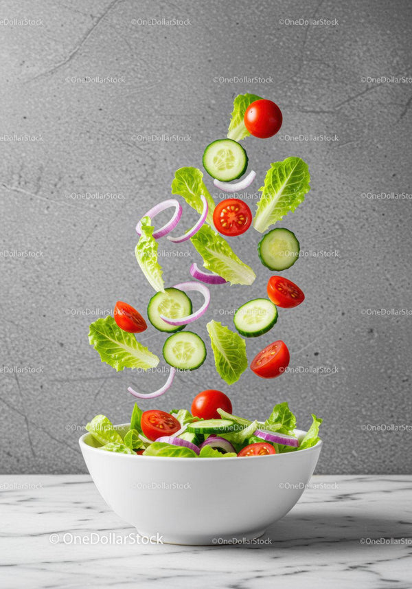 Fresh garden vegetables falling into white bowl salad