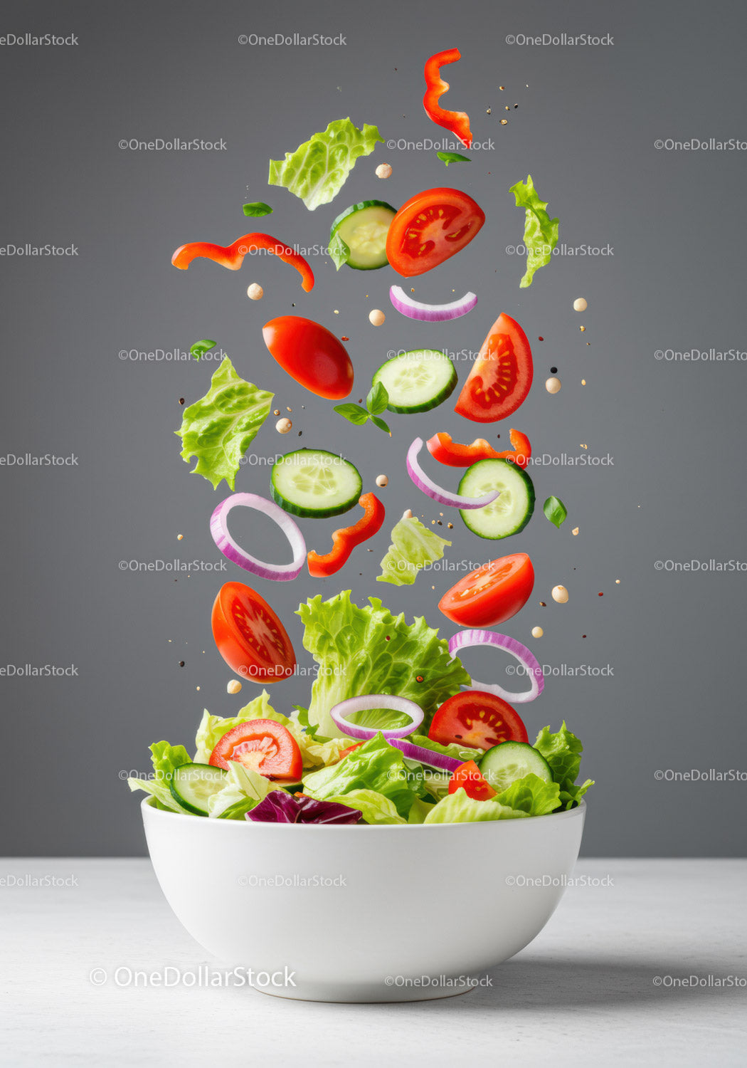 Fresh vegetable salad ingredients flying into bowl