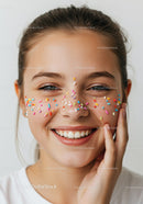 Joyful Woman Smiling with Colorful Sprinkles on Face in Celebration Scene