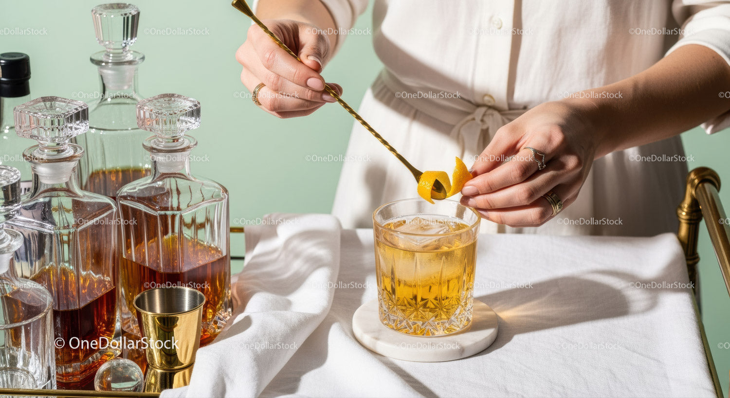 Elegant Amber Cocktail in Crystal Glass with Stirring Spoon