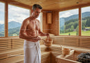 Man Relaxing in Wooden Sauna with Mountain Views Scenic Landscape