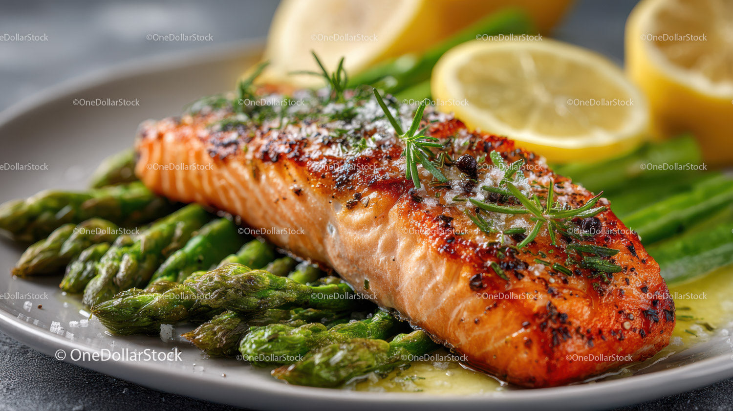 Grilled Salmon with Asparagus and Lemon Slices on a Plate