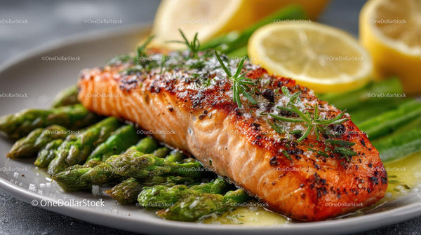 Grilled Salmon with Asparagus and Lemon Slices on a Plate