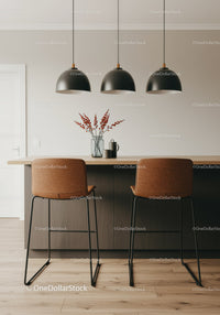 Modern Kitchen with Black Pendant Lights and Brown Bar Stools