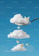 White ceramic birds flying around fluffy cloud shapes