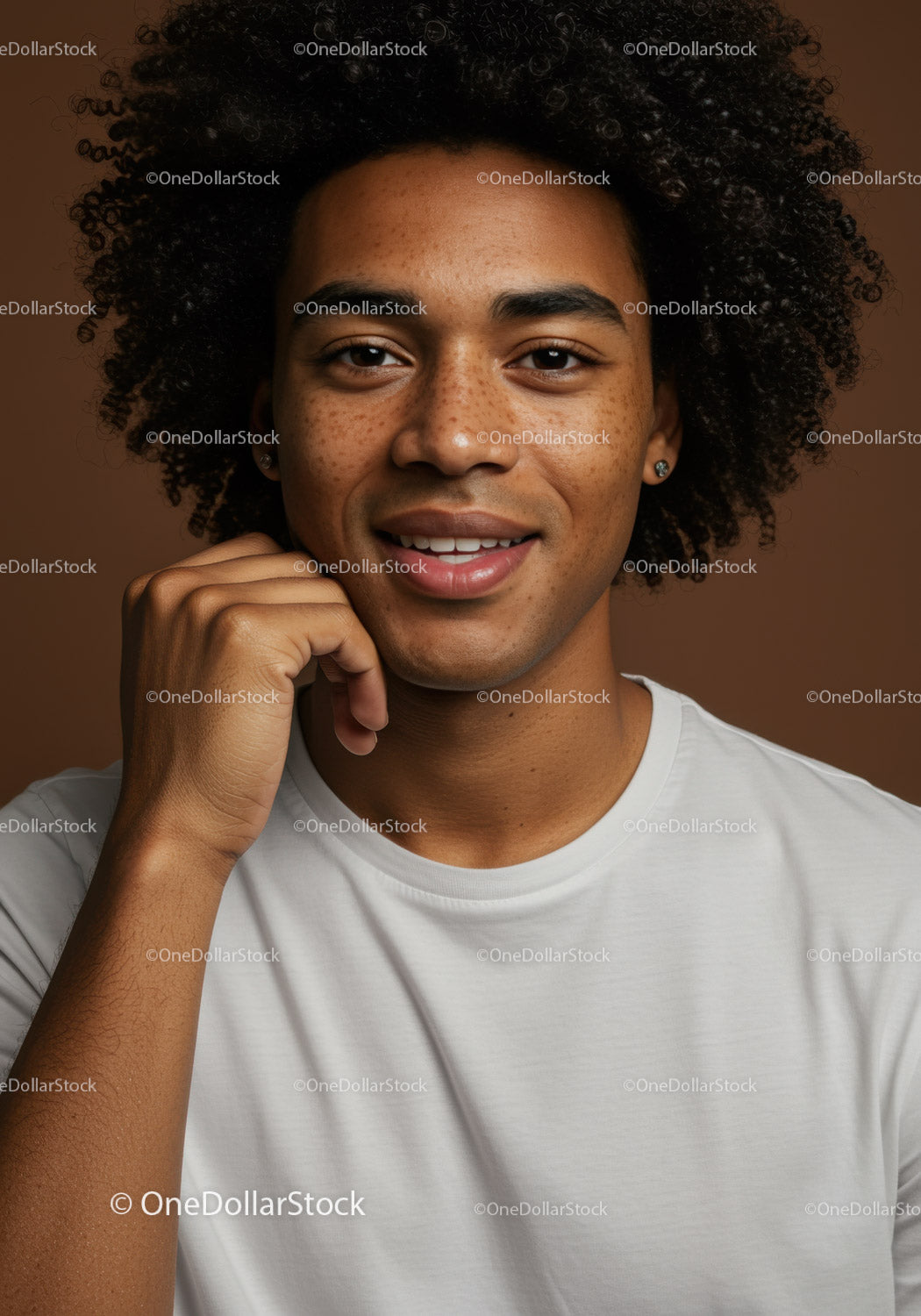 Portrait of a Smiling Young Man with Curly Hair and Freckles