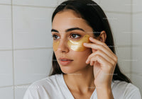 Young Woman Applying Under Eye Patches for Skincare Treatment