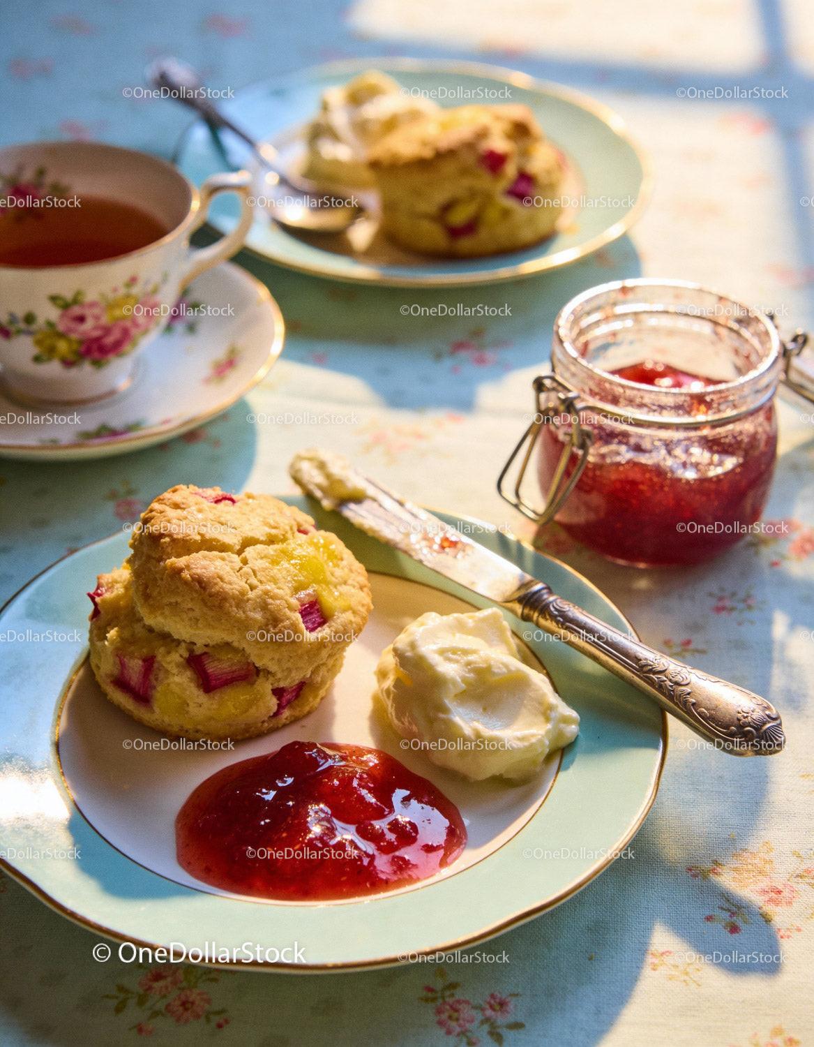 Homemade Scones with Jam and Cream on Vintage Plate